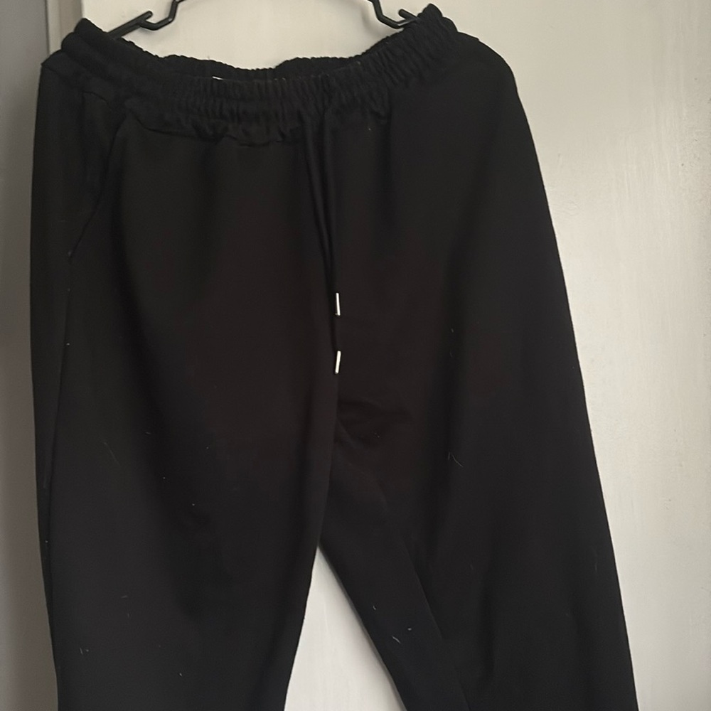 Black men’s sweatpants with purple japanese writing